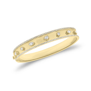 Bezel-Set Diamond Shapes Bangle Bracelet - 18K gold weighing 22.57 grams - 142 round diamonds weighing 0.86 carats - 2 marquise-shaped diamonds weighing 0.23 carats - 3 pear-shaped diamonds weighing 0.32 carats