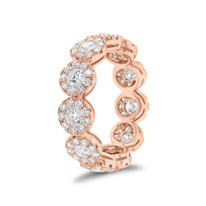 Diamond halo eternity ring -18K gold weighing 3.96 grams -11 round diamonds totaling 1.18 carats -99 round pave-set diamonds totaling 1.06 carats