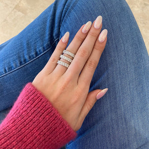 Female Model Wearing 4.47 ct Radiant-Cut Diamond Eternity Band - 18K gold weighing 4.60 grams - 22 radiant-cut diamonds weighing 4.47 carats (GIA-graded F-color, VS clarity)