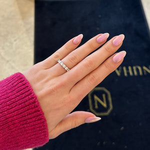 Female model wearing 3.76 ct Diamond Eternity Ring - 18K gold weighing 3.60 grams - 16 round diamonds weighing 3.76 carats (GIA-graded G-H color, SI1 clarity)