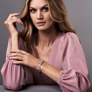 Diamond Pyramid Stud Bangle Bracelet -14K gold weighing 10.79 grams -315 round pave-set diamonds totaling 0.81 carats.