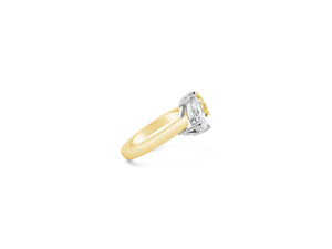 Unique Mixed Shape Two-stone Diamond Ring  -14k gold weighing 3.99 grams  -1 pear-shaped diamond weighing 1.25 carats  -1 fancy light yellow diamond radiant-cut weighing 1.25 carats with GIA-VS2 clarity