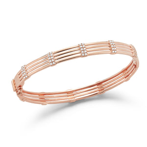Diamond Multilayer Bangle Bracelet -14K rose gold weighing 12.42 grams -100 round prong set diamonds totaling 0.62 carats