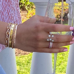 Female Model Wearing Pink Sapphire Eternity Band - 14K gold weighing 1.33 grams. - 32 pink sapphire weighing 0.49 carats total