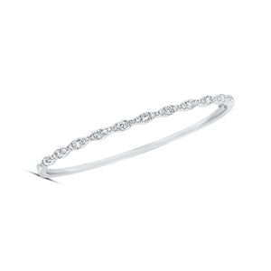 Diamond Ripple Bangle - 14K gold weighting 10.21 grams. - 45 round stones totaling 0.83 carats.