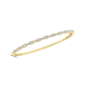 Diamond Ripple Bangle - 14K gold weighting 10.21 grams. - 45 round stones totaling 0.83 carats.