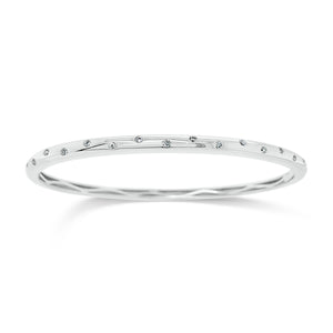 Diamond Dot Bangle Bracelet - 14K gold weighting 13.57 grams. - 17 Round Diamond totaling 0.25 carets.
