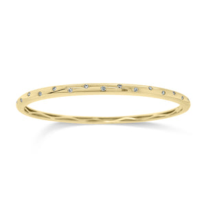Diamond Dot Bangle Bracelet - 14K gold weighting 13.57 grams. - 17 Round Diamond totaling 0.25 carets.