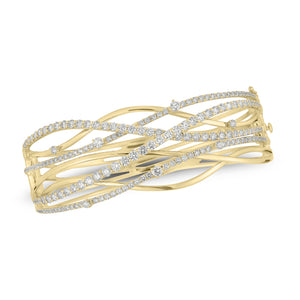Diamond Wave Bangle - 18K yellow gold weighing 36.72 grams - 49 round diamonds weighing 2.32 carats - 126 round diamonds weighing 2.10 carats
