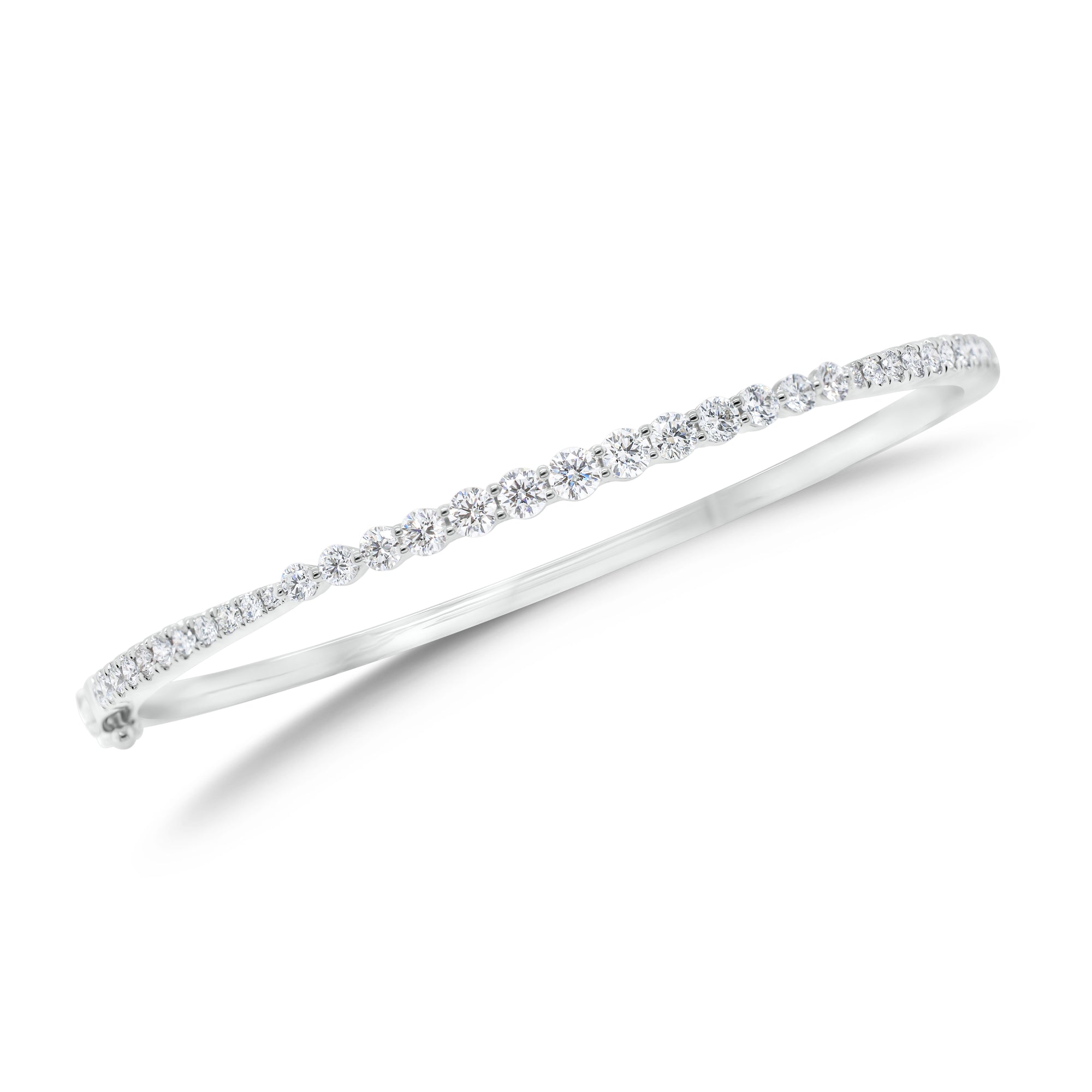 Graduated Diamond Bangle Bracelet - 18K white gold weighing 10.79 grams - 22 round diamonds totaling 0.39 carats - 13 round diamonds totaling 0.91 carats