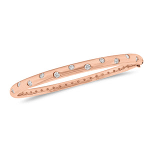 Diamond Dot Bangle - 18K gold weighing 18.57 grams - 11 round diamonds totaling 0.57 carats