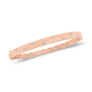 Solid 18K rose gold weighing 17.26 grams with 10 round diamonds weighing 0.40 carats Diamond Dot Bangle | Nuha Jewelers