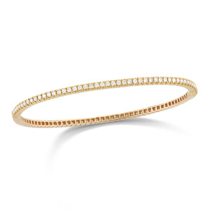 Diamond Eternity Bangle Bracelet -14K gold weighing 10 grams -94 shared prong-set round diamonds totaling 1.50 carats