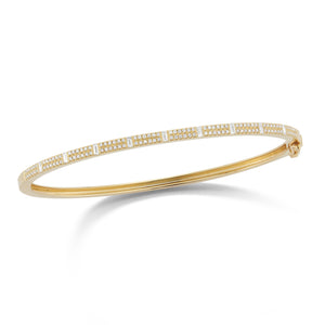Round & Baguette Diamond Bangle Bracelet -14K gold weighing 9.14 grams -9 baguettes totaling 0.26 carats -120 round diamonds 0.33 carats