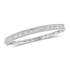 Round & Baguette Diamond Bangle - 14K gold weighing 13.12 grams - 143 round diamonds totaling 1.92 carats - 24 straight baguettes weighing 0.73 carats