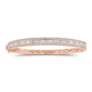 Round & Baguette Diamond Bangle - 14K gold weighing 13.12 grams - 143 round diamonds totaling 1.92 carats - 24 straight baguettes weighing 0.73 carats