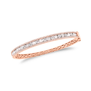 Round & Baguette Diamond Bangle - 14K gold weighing 13.12 grams - 143 round diamonds totaling 1.92 carats - 24 straight baguettes weighing 0.73 carats