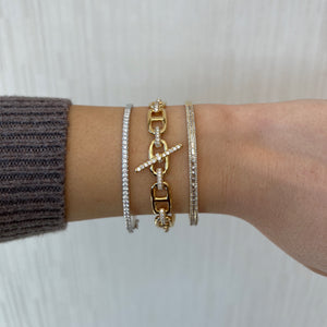 Female Model Wearing Pave Diamond Toggle Chain Link Bangle Bracelet -18K gold weighing 25.05 grams -147 round diamonds weighing 1.35 carats