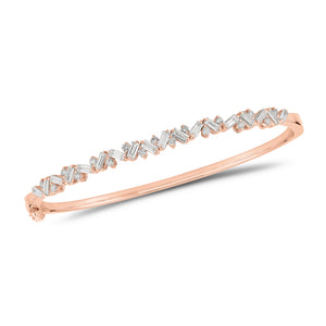 Slim Baguette and Round Diamond Bangle - 14K gold weighing 11.76 grams - 18 slim baguettes weighing 1.04 carats - 17 round diamonds weighing 0.37 carats