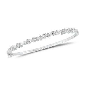 Slim Baguette and Round Diamond Bangle - 14K gold weighing 11.76 grams - 18 slim baguettes weighing 1.04 carats - 17 round diamonds weighing 0.37 carats