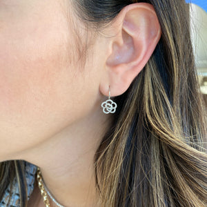 Female model wearing Diamond Rose Lever-Back Earrings - 14K gold weighing 2.00 grams - 104 round diamonds totaling 0.32 carats