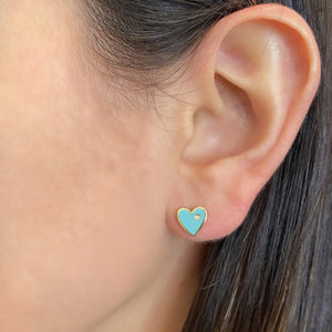 Female model wearing Diamond & enamel heart stud earrings - 14K gold weighing 1.36 grams  - 2 round diamonds totaling 0.01 carats