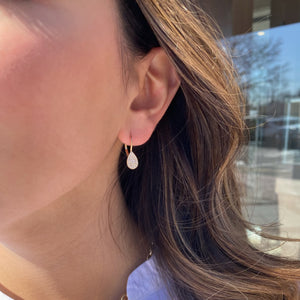 Female Model wearing solid 14K yellow gold weighing 1.76 grams featuring 94 round diamonds weighing 0.20 carats Pave Diamond Teardrop Lever-Back Earrings | Nuha Jewelers