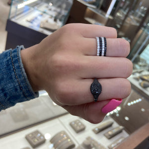 Female model wearing Diamond eternity band - 18K gold weighing 1.52 grams - 30 round diamonds totaling 0.84 carats