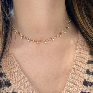 Female Model Wearing Diamond Drip Necklace - 14K gold weighing 10.33 grams - 9 round diamonds totaling 1 carat