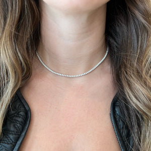 Female model wearing 10.61 ct Diamond Tennis Necklace - 14K gold weighing 19.91 grams - 166 round diamonds weighing 10.61 carats - 16-18” length