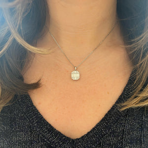 Female model wearing Baguette and round diamond octagon pendant - 14K gold weighing 4.0 grams - 16 round diamonds weighing 0.21 carats - 10 slim baguettes weighing 0.84 carats
