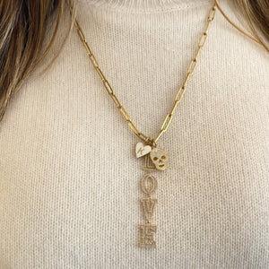 Female Model Wearing Gold & Enamel Heart Initial Pendant  - 14K gold weighing 1.15 grams  Available in yellow, white, and rose gold.
