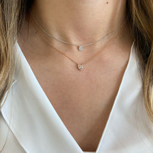 Female Model Wearing Pave Diamond Teardrop Pendant  - 14K gold weighing 1.61 grams  - 25 round diamonds totaling 0.06 carats