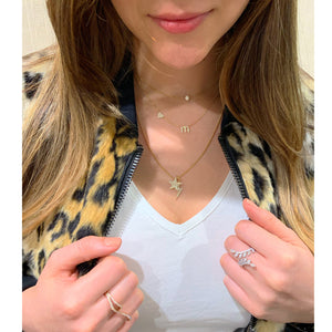Female Model Wearing Items sold separately.  Diamond Star & Lightning Bolt Pendants  -0.31 total carat weight (star) set in 14kt gold weighing 0.74 grams  -0.25 total carat weight (lightning bolt) set in 14kt gold weighing 0.76 grams  Available in yellow, white, and rose gold.