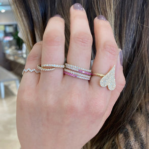Female Model Wearing Gradient Diamond and Pink Sapphire Eternity Ring -14K gold weighing 1.42 grams -20 round diamonds totaling 0.26 carats -21 pink sapphires totaling 0.38 carats