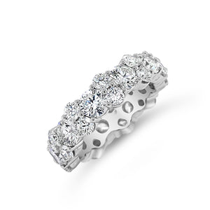 Staggered Diamond Eternity Band Lg -18K gold weighing 6.91 grams -11 round diamonds totaling 3.15 carats -22 round diamonds totaling 1.87 carats