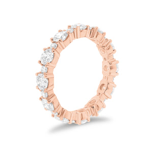 Diamond Eternity Band -18K gold weighing 3.07 grams -12 round diamonds totaling 2.13 carats -12 round diamonds totaling 0.43 carats