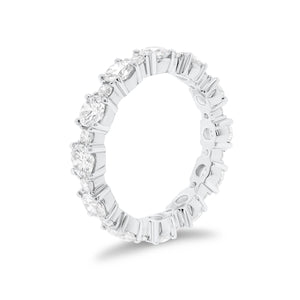 Diamond Eternity Band -18K gold weighing 3.07 grams -12 round diamonds totaling 2.13 carats -12 round diamonds totaling 0.43 carats
