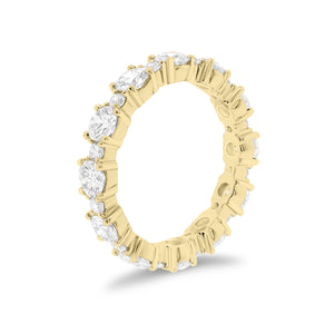 Diamond Eternity Band -18K gold weighing 3.07 grams -12 round diamonds totaling 2.13 carats -12 round diamonds totaling 0.43 carats