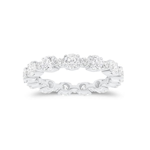 Diamond Eternity Band -18K gold weighing 3.07 grams -12 round diamonds totaling 2.13 carats -12 round diamonds totaling 0.43 carats