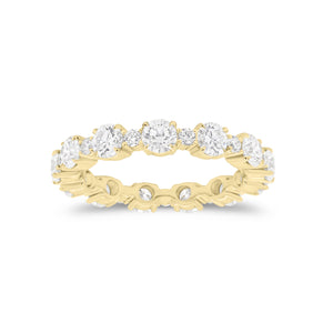 Diamond Eternity Band -18K gold weighing 3.07 grams -12 round diamonds totaling 2.13 carats -12 round diamonds totaling 0.43 carats