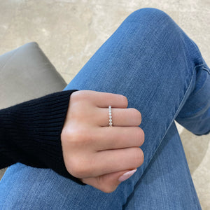 Female model wearing Single-Prong Diamond Eternity Ring- 18K white gold weighing 1.65 grams - 23 round diamonds weighing 1.15 carats