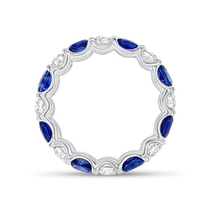 Sapphire & Diamond Eternity Ring - 18K gold weighing 2.67 grams - 8 round diamonds totaling 1.10 carats - 8 oval-shaped sapphires totaling 2.46 carats