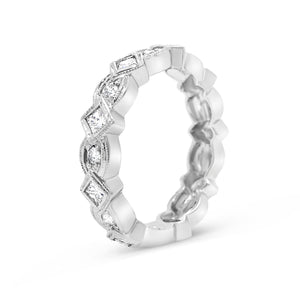 Geometric diamond eternity band ring -14k gold weighing 4.1 grams -8 round diamonds weighing .24 carats -9 PR weighing .68 carats