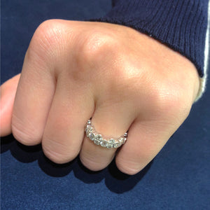 Female Model Wearing Alternating Bezel-Set Diamond Eternity Ring with Antique Milgrain