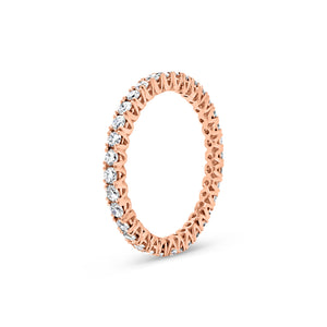 Simple diamond eternity band ring -18k gold weighing 1.61 grams -34 round four prong-set diamonds weighing .84 carats