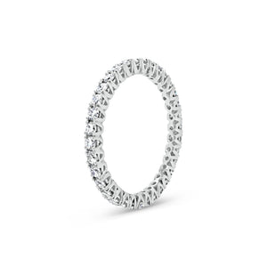 Simple diamond eternity band ring -18k gold weighing 1.61 grams -34 round four prong-set diamonds weighing .84 carats