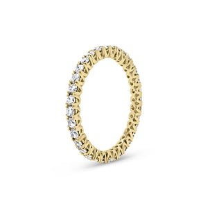 Simple diamond eternity band ring -18k gold weighing 1.61 grams -34 round four prong-set diamonds weighing .84 carats
