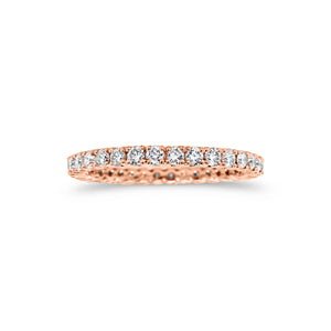 Simple diamond eternity band ring -18k gold weighing 1.61 grams -34 round four prong-set diamonds weighing .84 carats