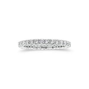 Simple diamond eternity band ring -18k gold weighing 1.61 grams -34 round four prong-set diamonds weighing .84 carats